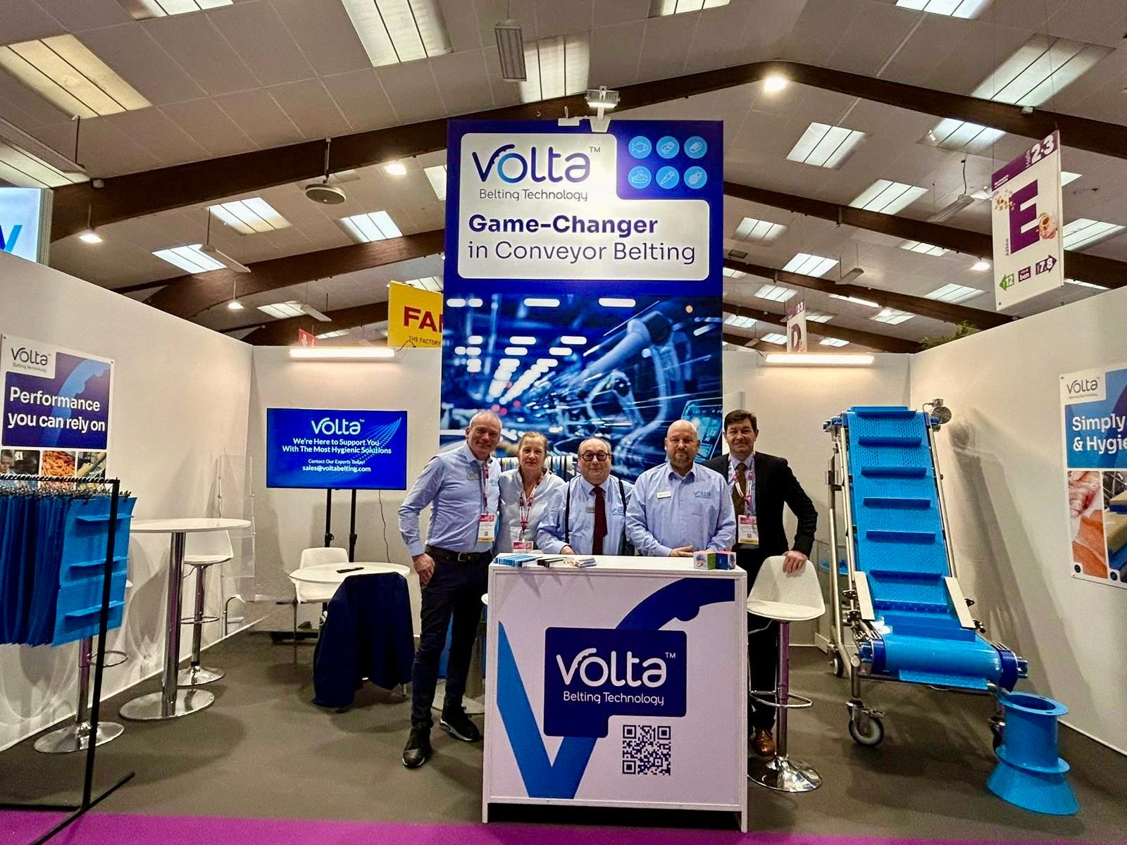 Trade show booth with staff members